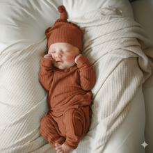 Load image into Gallery viewer, Rust waffle knit baby outfit set – fall newborn long sleeve top, pants with drawstring, and knotted beanie hat.