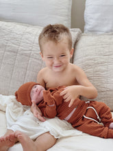 Load image into Gallery viewer, Cozy unisex waffle knit baby set – rust brown long sleeve top, jogger pants, and hat for newborn boys and girls
