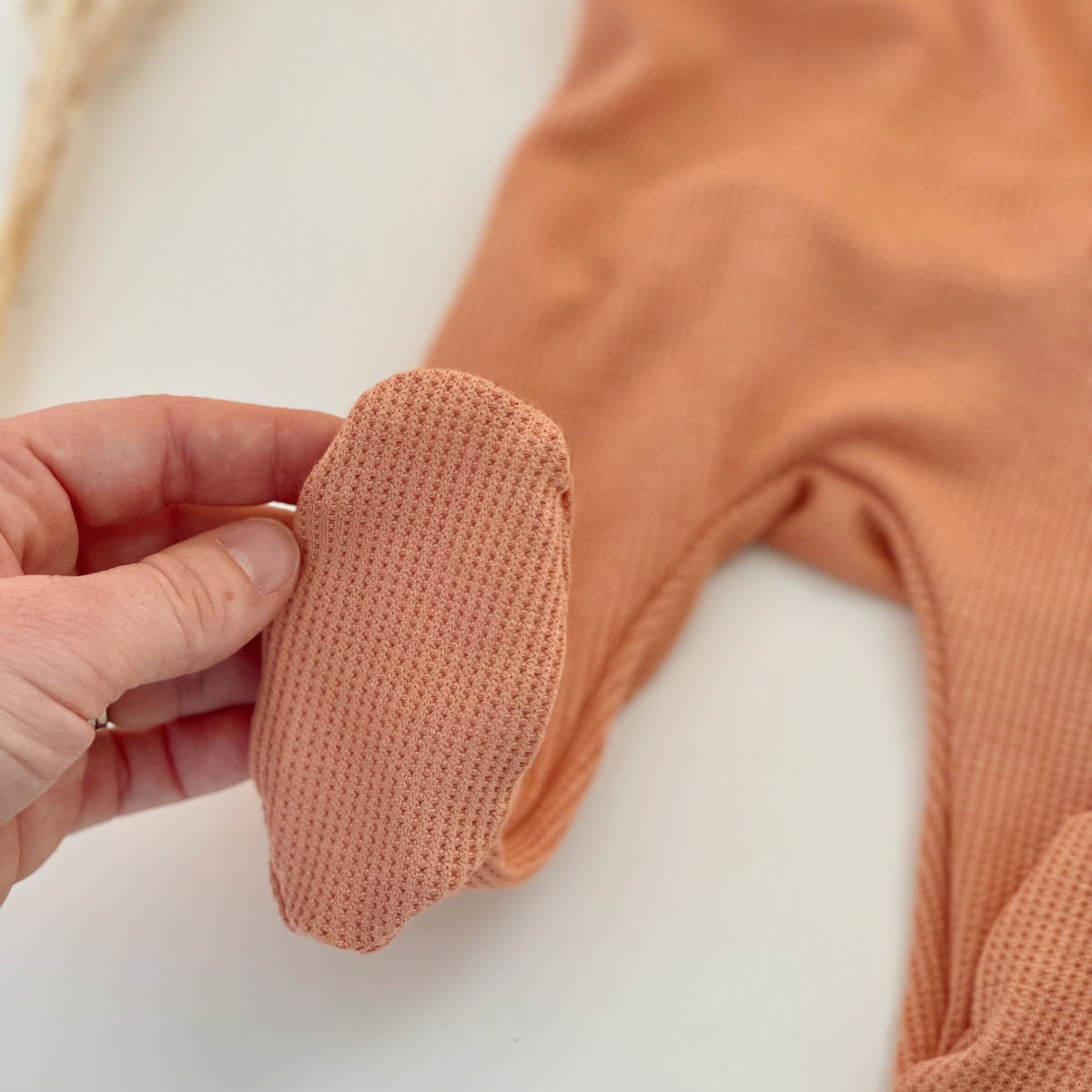 baby girl footie pajamas in peachy pink