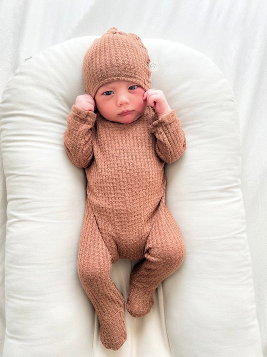 gender neutral newborn back flap footie outfit, cozy one-piece for babies, ideal for nighttime diaper changes.