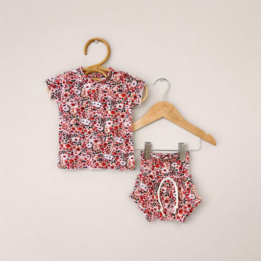 A shortie set for babies, consisting of a floral print top and matching shorts