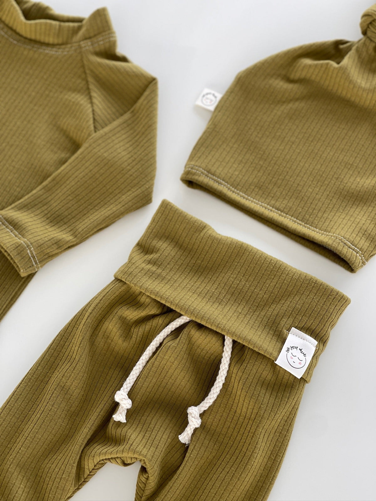 Soft ribbed knit fabric close-up – breathable cotton blend baby outfit in lime green