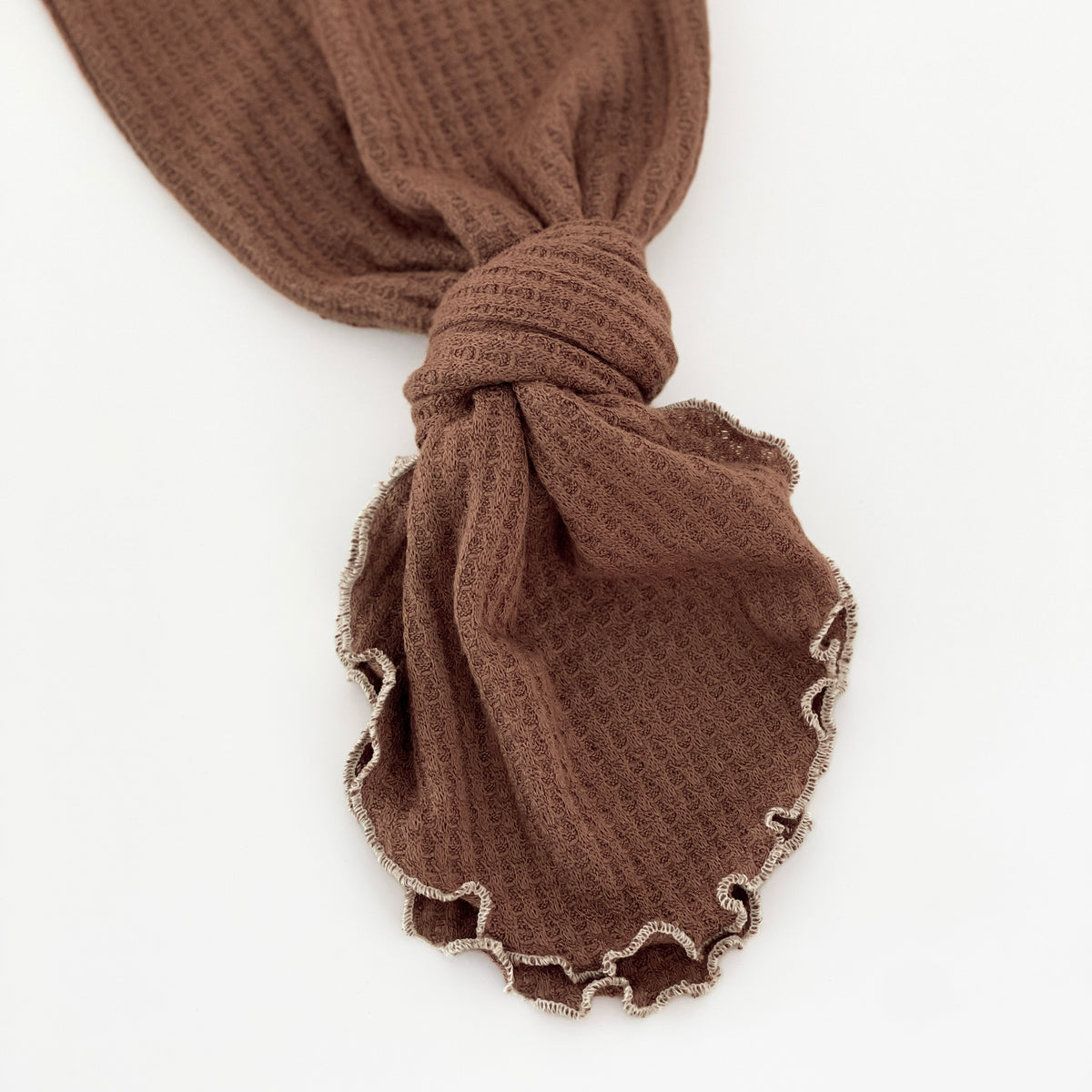brown tied knotted baby gown