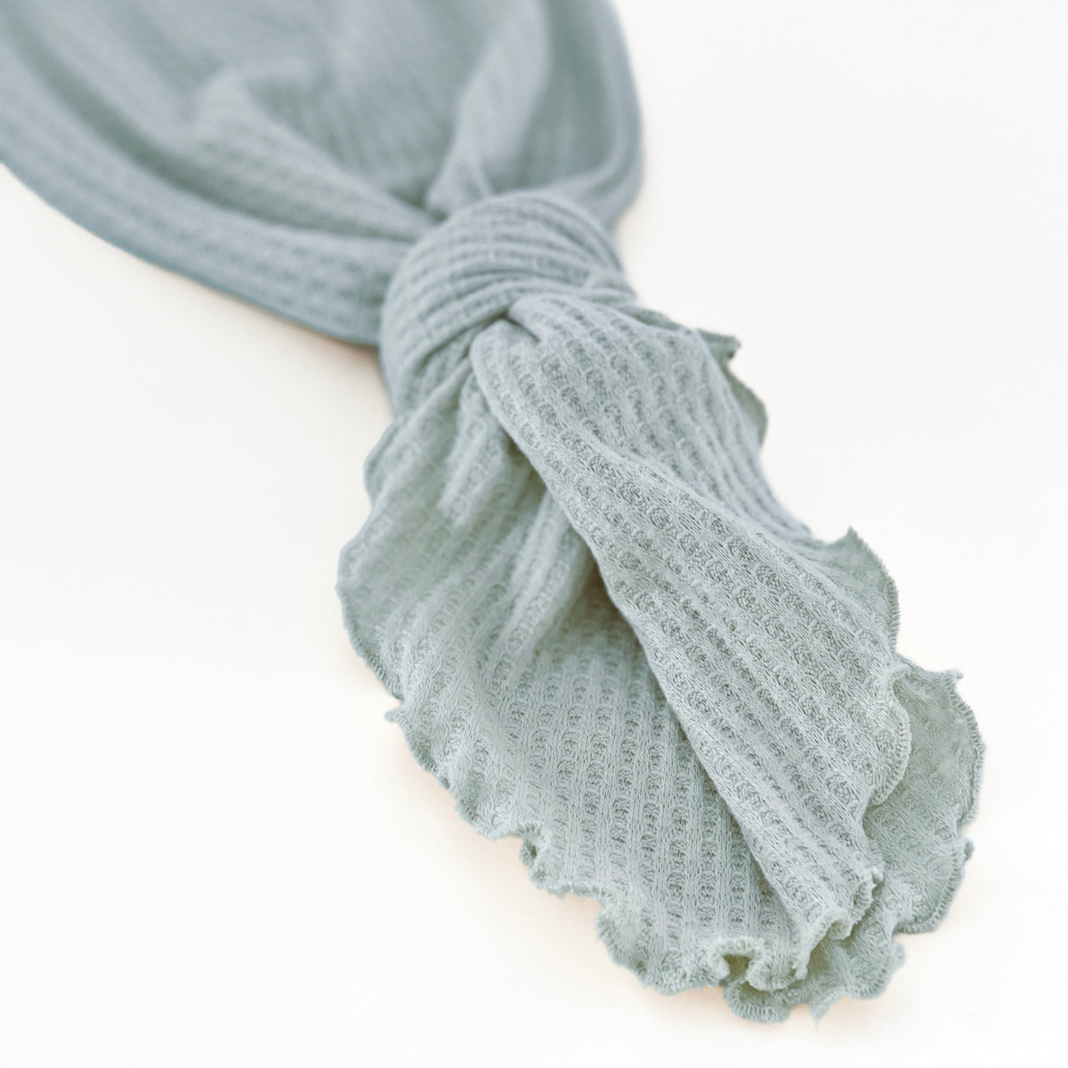 Knotted baby gown in dusty blue color