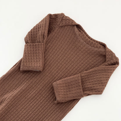 A brown waffle-knit long-sleeve gown 
