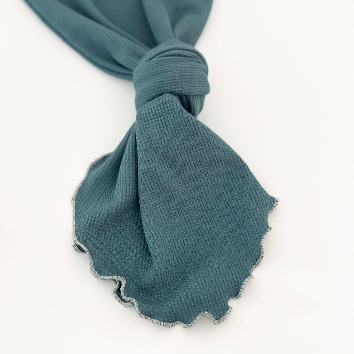 baby gown tied in a knot