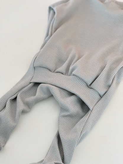 light blue baby boy onesie with a back flap for nighttime changing.