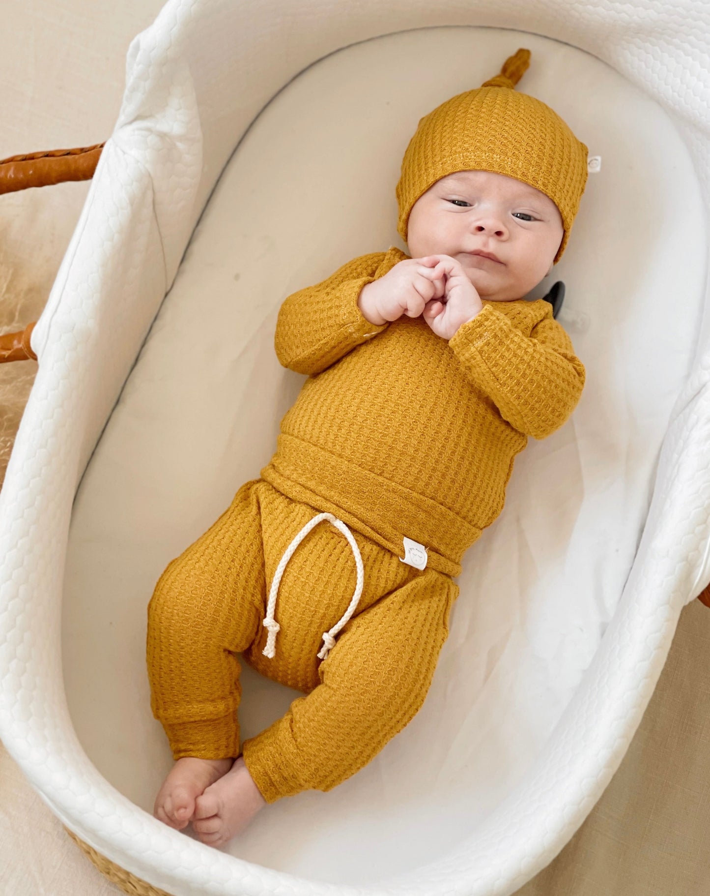 Mustard waffle knit newborn onesie, cozy take-home outfit