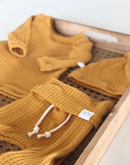 Trendy yellow baby shower gift, gender neutral waffle outfi