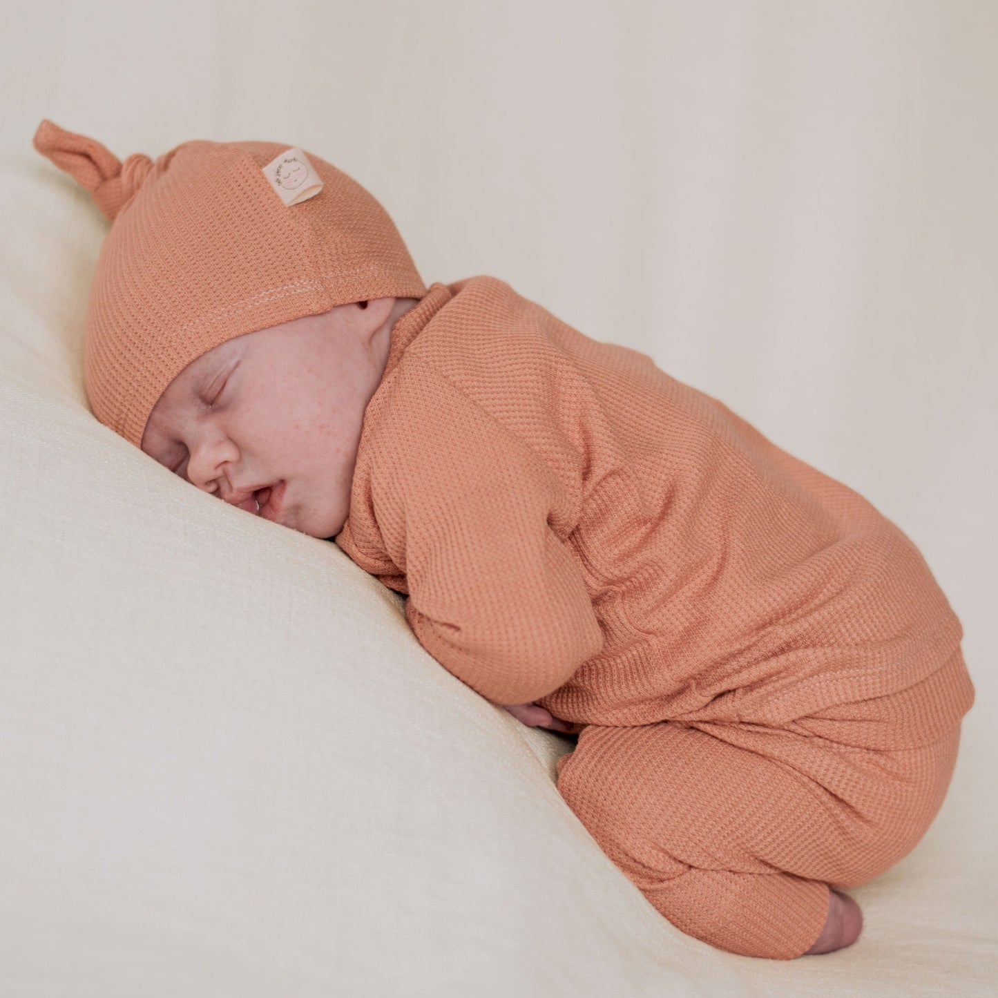 Peach color baby girl outfit with footies, soft and breathable baby girl clothes.